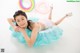 A young girl laying on an inflatable pool float.