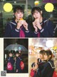 A couple of girls in school uniforms eating ice cream.